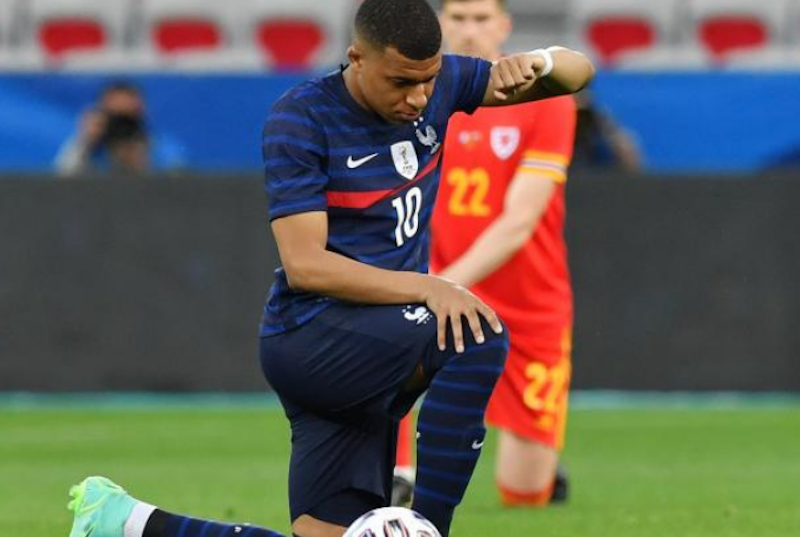 French footballer Kylian Mbappé kneeling down against racism. (Photo: video grab)